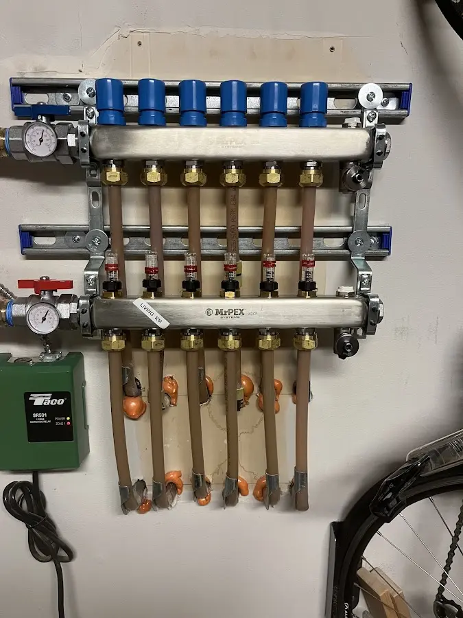 Plumber performing Water Heater Repair at a residential property in Syracuse